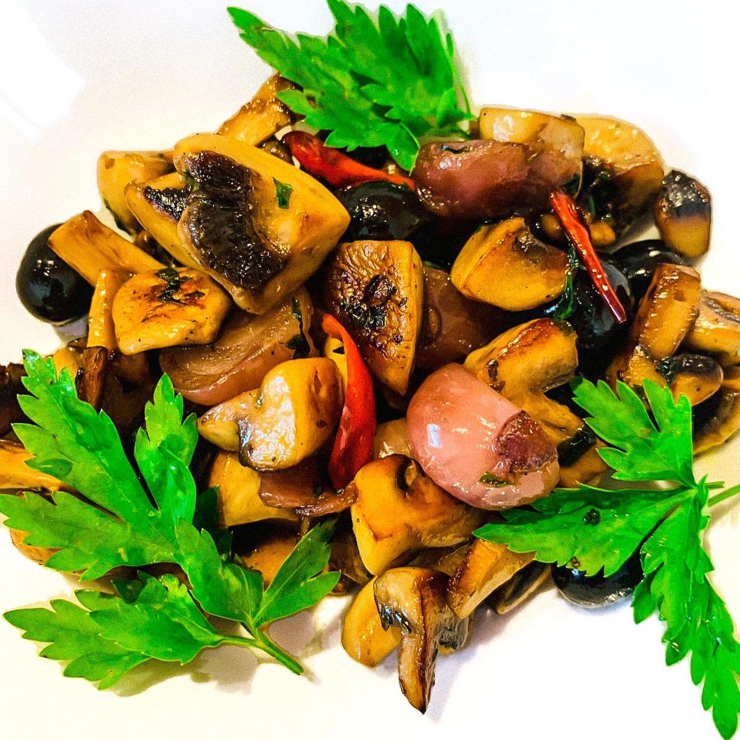 Seafood and mussels with herbs and vegetables.